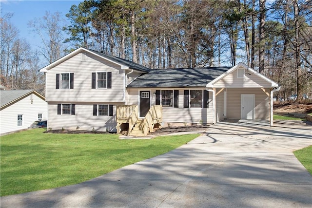 tri-level home with a front yard and a carport