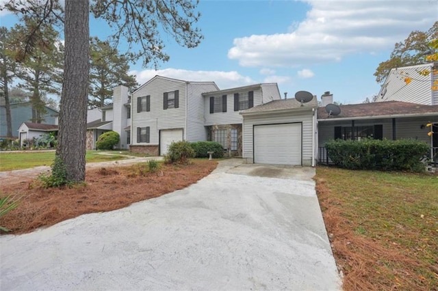 703 Pine Tree Trl, Atlanta, GA 30349 - view of front of home with a garage and a front lawn
