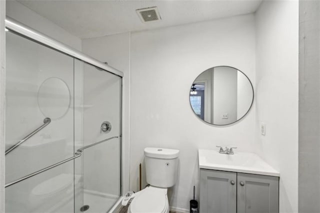 703 Pine Tree Trl, Atlanta, GA 30349 - bathroom featuring toilet, walk in shower, and vanity