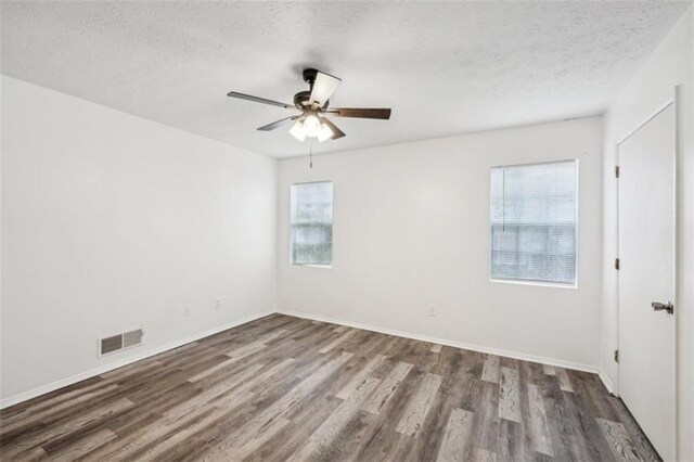 703 Pine Tree Trl, Atlanta, GA 30349 - unfurnished room featuring ceiling fan, a textured ceiling, and hardwood / wood-style flooring