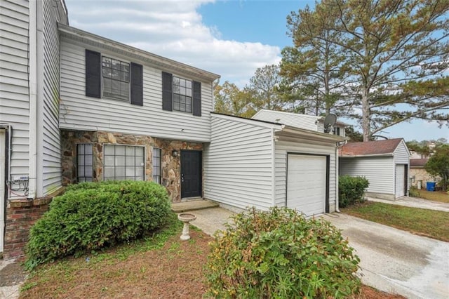 703 Pine Tree Trl, Atlanta, GA 30349 - view of front of house with a garage