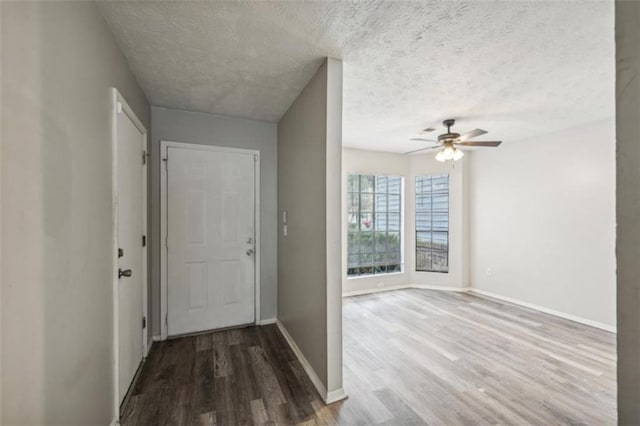 703 Pine Tree Trl, Atlanta, GA 30349 - entrance foyer with a textured ceiling, ceiling fan, and wood-type flooring
