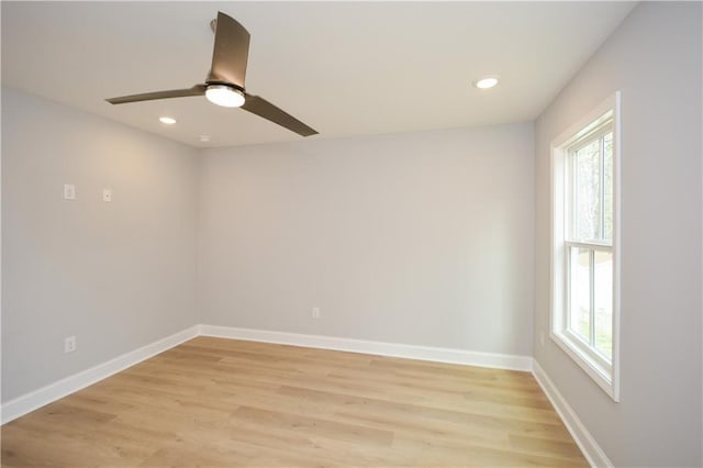 empty room with light hardwood / wood-style flooring and ceiling fan