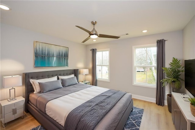 bedroom featuring ceiling fan and light wood-type flooring