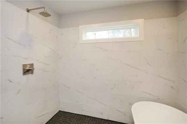 bathroom featuring a tile shower