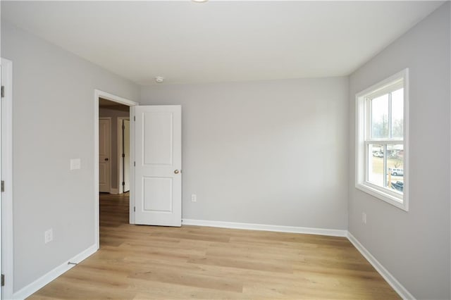 unfurnished room featuring light hardwood / wood-style floors