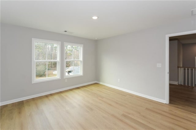 unfurnished room featuring light wood-type flooring