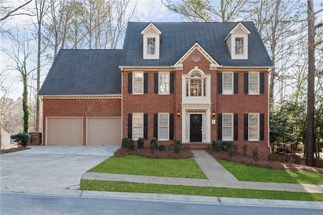 view of front of home featuring a garage, brick siding, roof with shingles, and concrete driveway