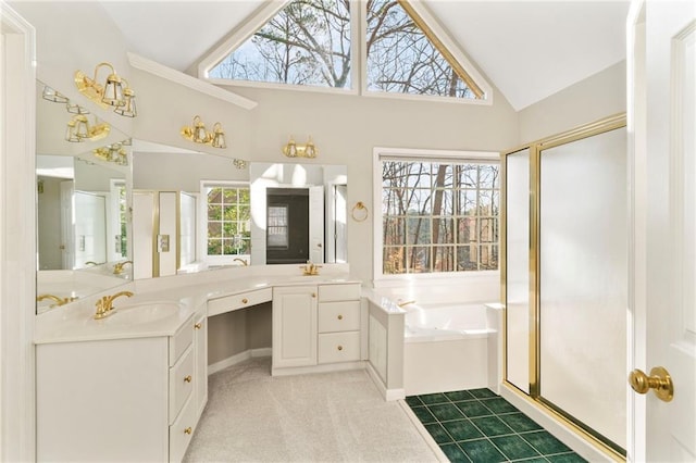 full bathroom with two vanities, a stall shower, a bath, high vaulted ceiling, and a sink