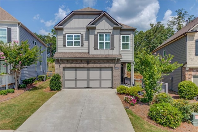 6410 Crosscreek Ln, Flowery Branch, GA 30542 - craftsman inspired home featuring brick siding, board and batten siding, concrete driveway, a garage, and a front lawn