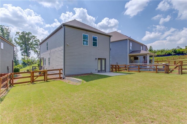 6410 Crosscreek Ln, Flowery Branch, GA 30542 - back of house featuring a fenced backyard, a gazebo, and a patio