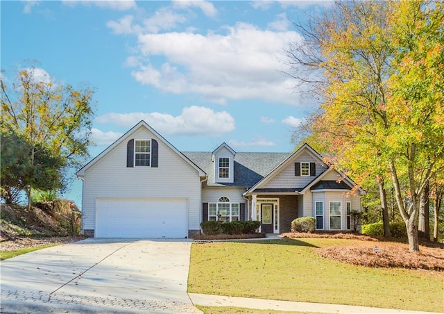 view of front of home featuring a front yard and a garage