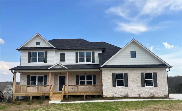 view of front of home featuring a porch and a shingled roof