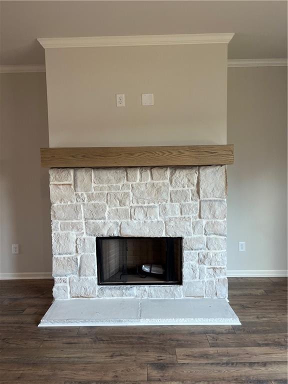 room details featuring a stone fireplace, wood finished floors, baseboards, and ornamental molding