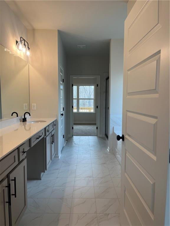 full bathroom with an enclosed shower, marble finish floor, vanity, and a garden tub