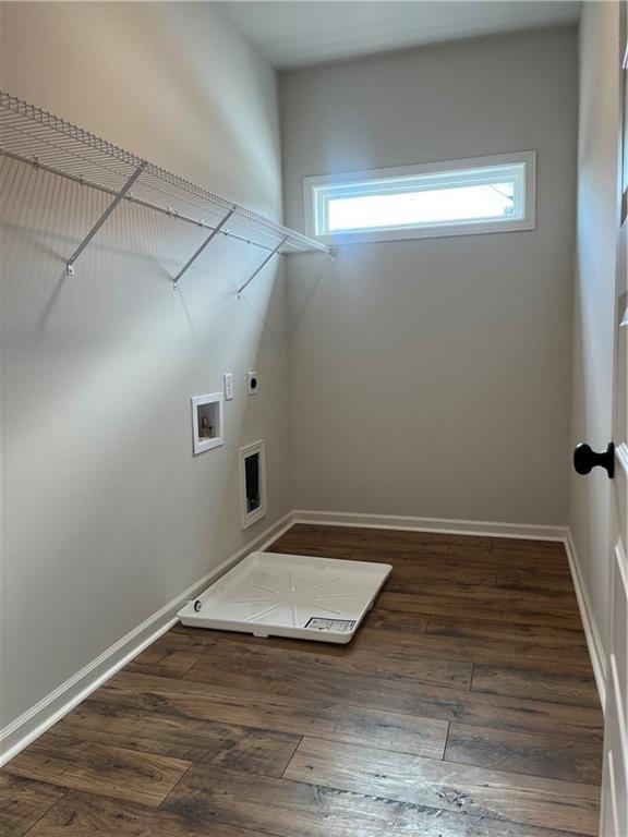 washroom with laundry area, hookup for an electric dryer, baseboards, and wood-type flooring