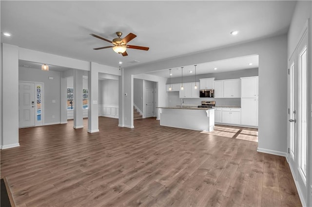 16 Grove Pointe Way SE, Cartersville, GA 30120 - unfurnished living room featuring ceiling fan, wood finished floors, recessed lighting, a sink, and baseboards