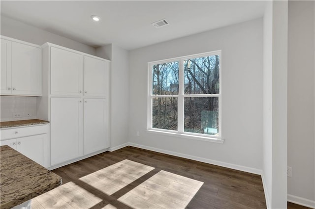 16 Grove Pointe Way SE, Cartersville, GA 30120 - unfurnished dining area featuring baseboards, dark wood-type flooring, and recessed lighting