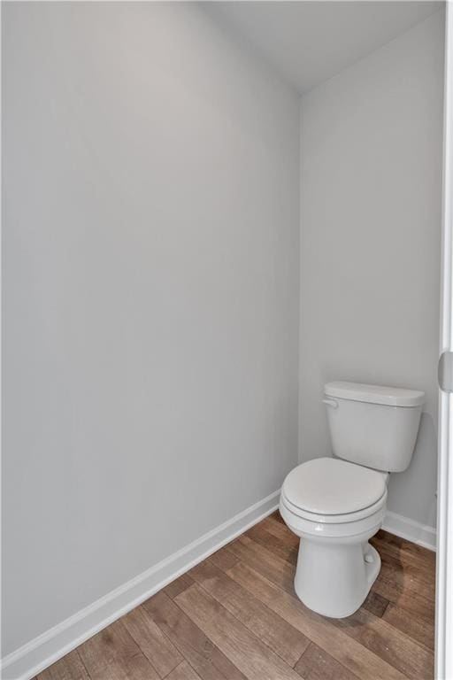 16 Grove Pointe Way SE, Cartersville, GA 30120 - bathroom featuring baseboards, wood finished floors, and toilet