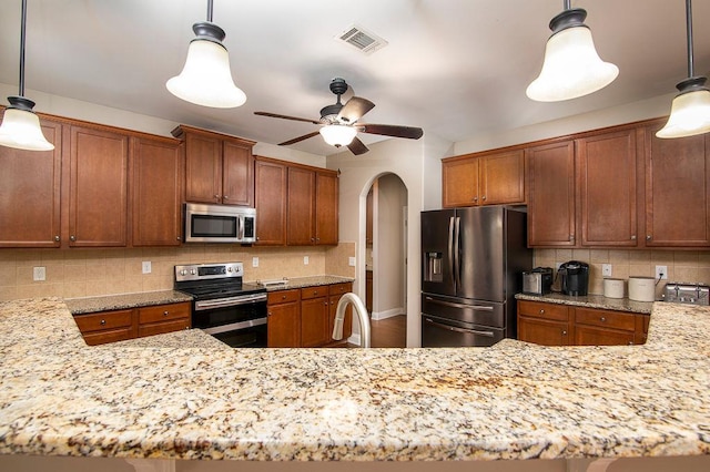 3631 Guinevere Trce, Douglasville, GA 30135 - kitchen featuring stainless steel appliances, arched walkways, backsplash, and ceiling fan