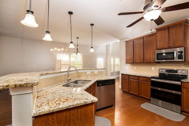 3631 Guinevere Trce, Douglasville, GA 30135 - kitchen featuring stainless steel appliances, a sink, decorative backsplash, ceiling fan, and wood finished floors