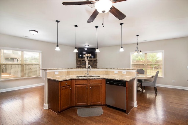 3631 Guinevere Trce, Douglasville, GA 30135 - kitchen with stainless steel dishwasher, a sink, dark wood-type flooring, and baseboards
