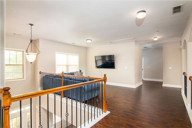 3631 Guinevere Trce, Douglasville, GA 30135 - hall with attic access, an upstairs landing, dark wood finished floors, and baseboards