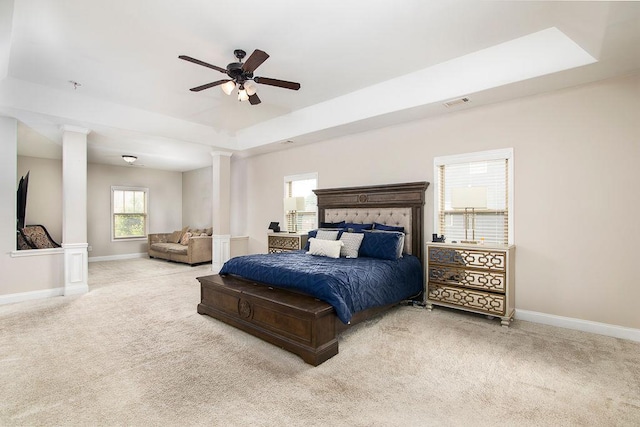 3631 Guinevere Trce, Douglasville, GA 30135 - carpeted bedroom featuring decorative columns, baseboards, a raised ceiling, and ceiling fan