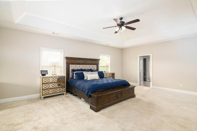 3631 Guinevere Trce, Douglasville, GA 30135 - bedroom with a tray ceiling, light colored carpet, baseboards, and a ceiling fan