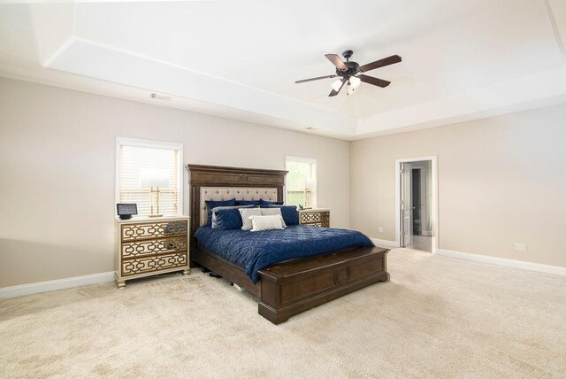 3631 Guinevere Trce, Douglasville, GA 30135 - bedroom with a tray ceiling, light carpet, baseboards, and a ceiling fan
