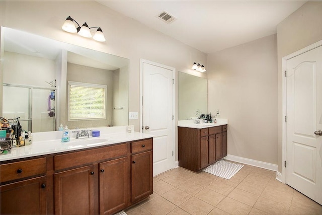 3631 Guinevere Trce, Douglasville, GA 30135 - bathroom with a stall shower, tile patterned floors, two vanities, and baseboards