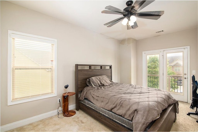 3631 Guinevere Trce, Douglasville, GA 30135 - bedroom featuring light carpet, baseboards, access to exterior, and a ceiling fan