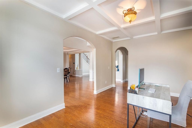 3631 Guinevere Trce, Douglasville, GA 30135 - office area featuring arched walkways, coffered ceiling, baseboards, wood finished floors, and beamed ceiling