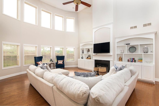 3631 Guinevere Trce, Douglasville, GA 30135 - living area with a high ceiling, ceiling fan, baseboards, and a fireplace