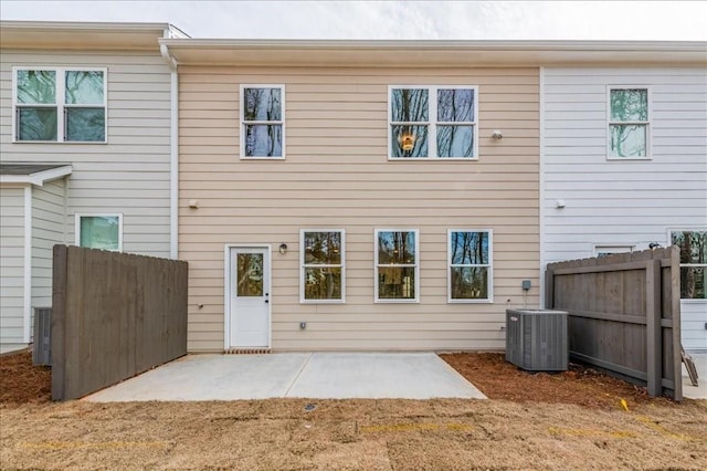 back of house featuring central AC unit and a patio