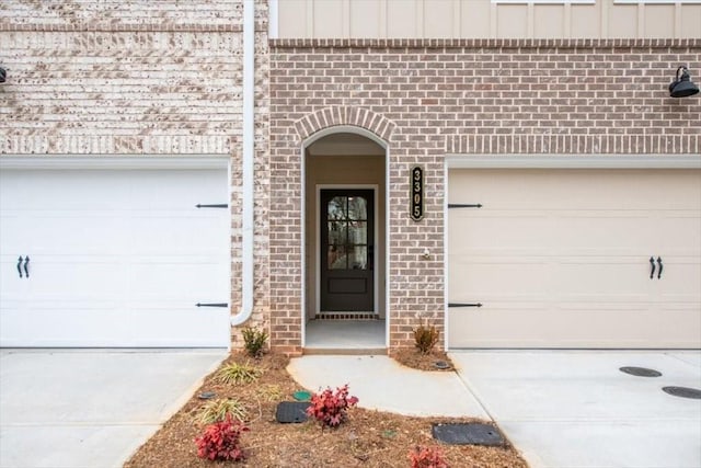 doorway to property with a garage