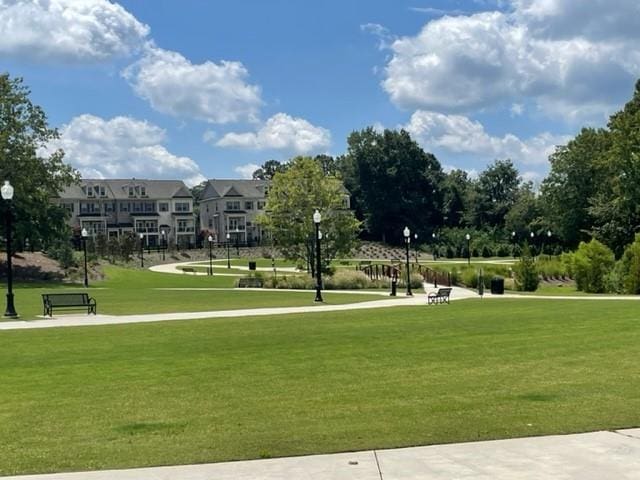 surrounding community featuring a lawn