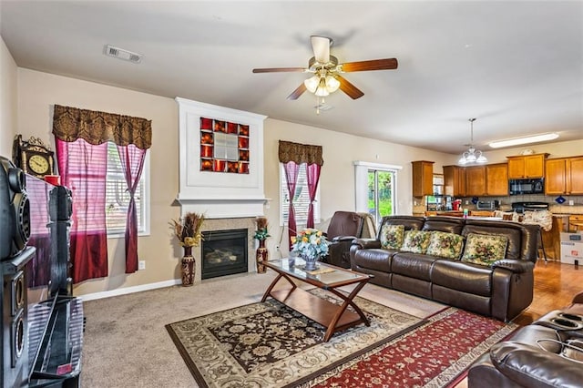 635 Crosswinds Cir, Marietta, GA 30008 - living room with ceiling fan, a glass covered fireplace, carpet, and baseboards