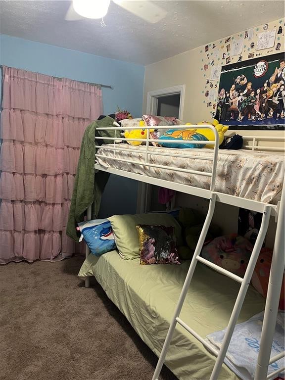 bedroom featuring ceiling fan and carpet flooring