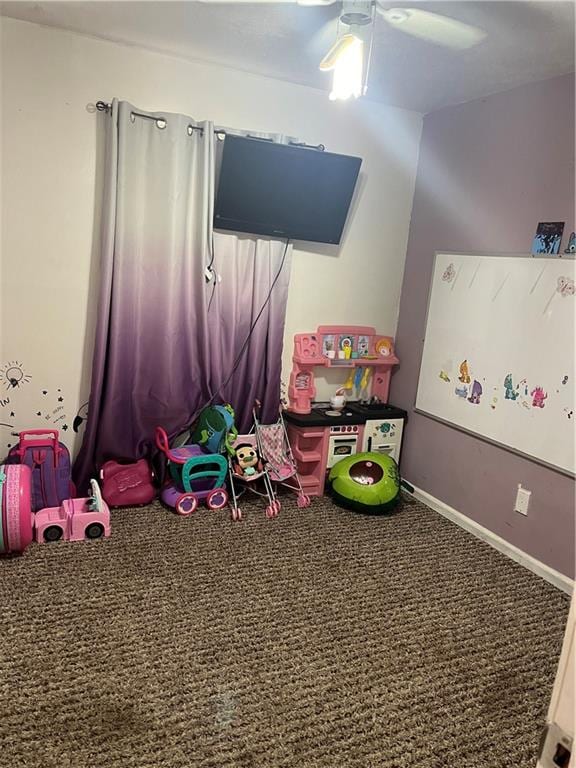 game room with ceiling fan and carpet