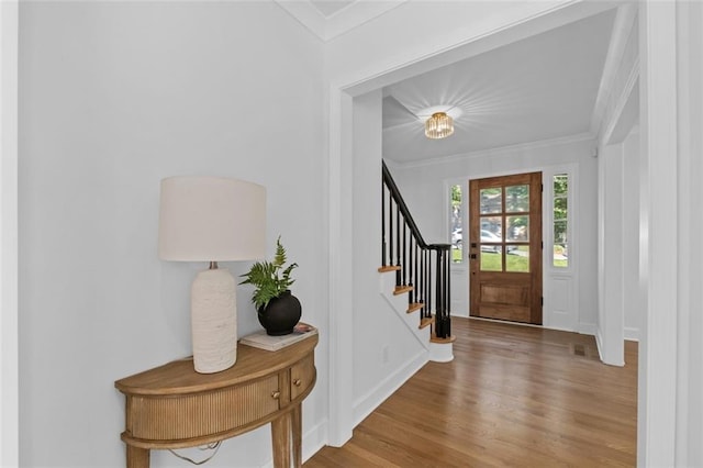 5143 Meadowlake Ln, Dunwoody, GA 30338 - foyer entrance with crown molding, wood finished floors, baseboards, and stairs