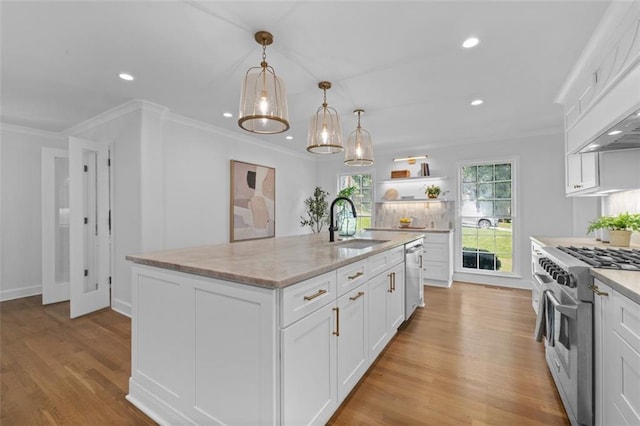 5143 Meadowlake Ln, Dunwoody, GA 30338 - kitchen featuring stainless steel appliances, a sink, white cabinets, recessed lighting, and light wood-style floors