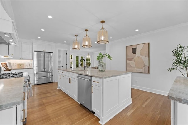 5143 Meadowlake Ln, Dunwoody, GA 30338 - kitchen with high end appliances, a sink, white cabinetry, light wood-style floors, and recessed lighting