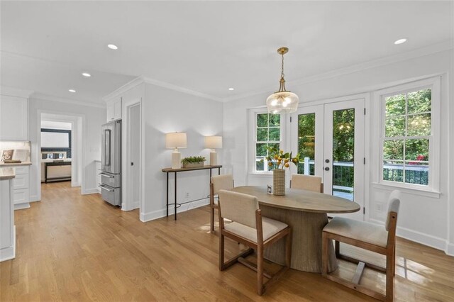 5143 Meadowlake Ln, Dunwoody, GA 30338 - dining space with light wood-type flooring, crown molding, recessed lighting, baseboards, and french doors