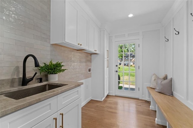 5143 Meadowlake Ln, Dunwoody, GA 30338 - mudroom with a sink, light wood-style flooring, and recessed lighting