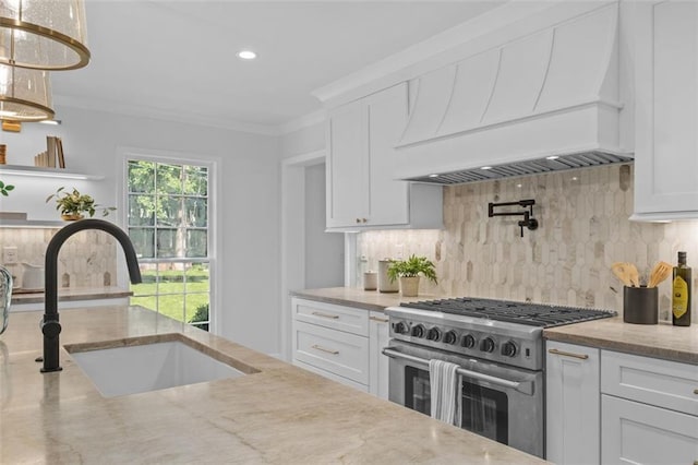 5143 Meadowlake Ln, Dunwoody, GA 30338 - kitchen with high end stainless steel range oven, custom range hood, a sink, decorative backsplash, and white cabinetry