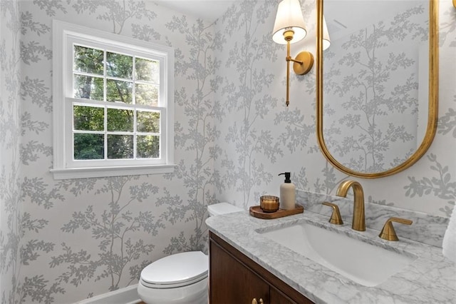 5143 Meadowlake Ln, Dunwoody, GA 30338 - bathroom with healthy amount of natural light, vanity, and toilet
