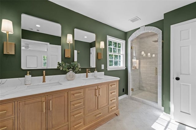 5143 Meadowlake Ln, Dunwoody, GA 30338 - full bath featuring a stall shower, double vanity, baseboards, and ceiling fan