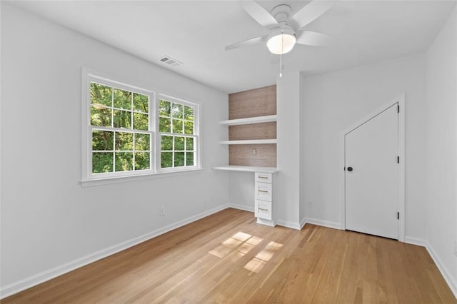 5143 Meadowlake Ln, Dunwoody, GA 30338 - unfurnished bedroom with light wood finished floors, baseboards, and a ceiling fan