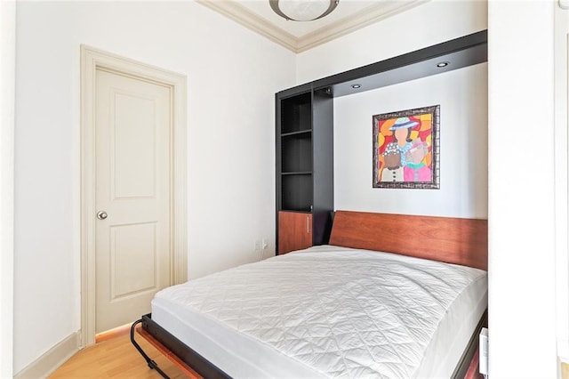 3445 Stratford Rd NE Unit 1605, Atlanta, GA 30326 - bedroom featuring light wood-style flooring, ornamental molding, and baseboards